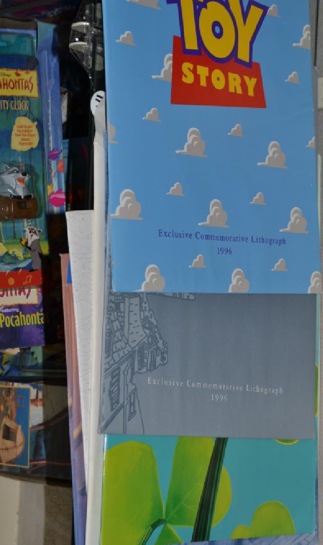 Grouping of Eleven Disney Lithographs From: Grouping of Disney Lithographs from beloved`movies, including; Hercules, Toy Story, Beauty and the Beast, Lady and the Tramp, Lion King 2, Jungle Book (two), 101 Dalmatians, The Fox and the Hound, Hun