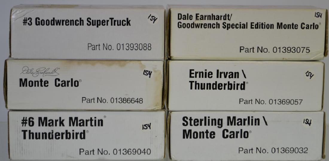 Grouping of Six Collectible Die Cast Cars: Grouping of Six Collectible Die Cast Cars including: 6 NIB (1) Sterling Marlin, (1) Ernie Irvan, (1) Dale Earnhardt (1) #3 Goodwrench super truck, (1) #6 Mark Martin. (all boxes have some staining and