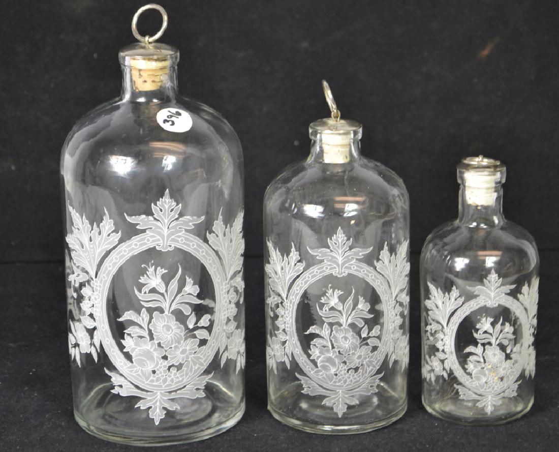 Three Decorative Mid Century Apothecary Jars: Three Decorative Mid Century Apothecary Jars, largest 8.5"H, jars have no chips or cracks, all have original tops and stoppers, and there is no loss to applied floral decoration