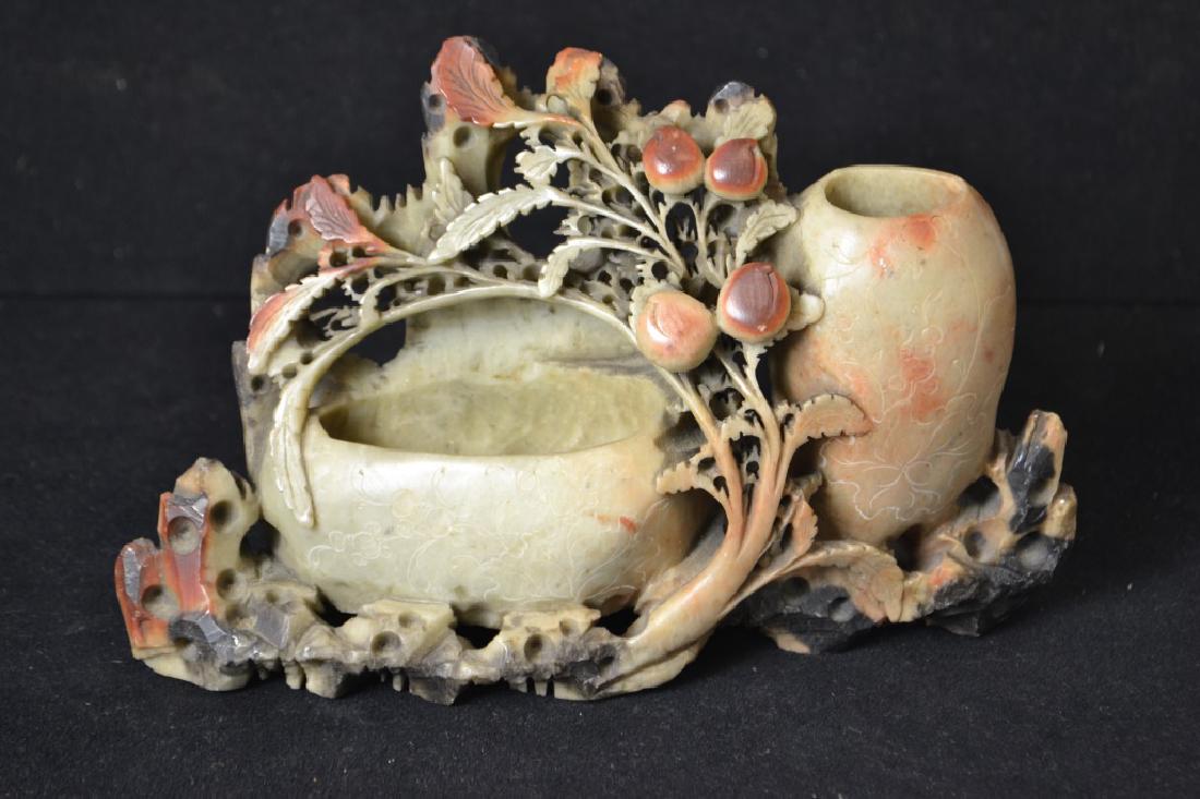 Ornately Carved Soapstone Brushpot: Ornately Carved Soapstone Brushpot standing appx 6"H and 9"W, item has what appears to be fruit and branches, bears a double brush pot with extensive reticulation, one minor chip on rear of base but o