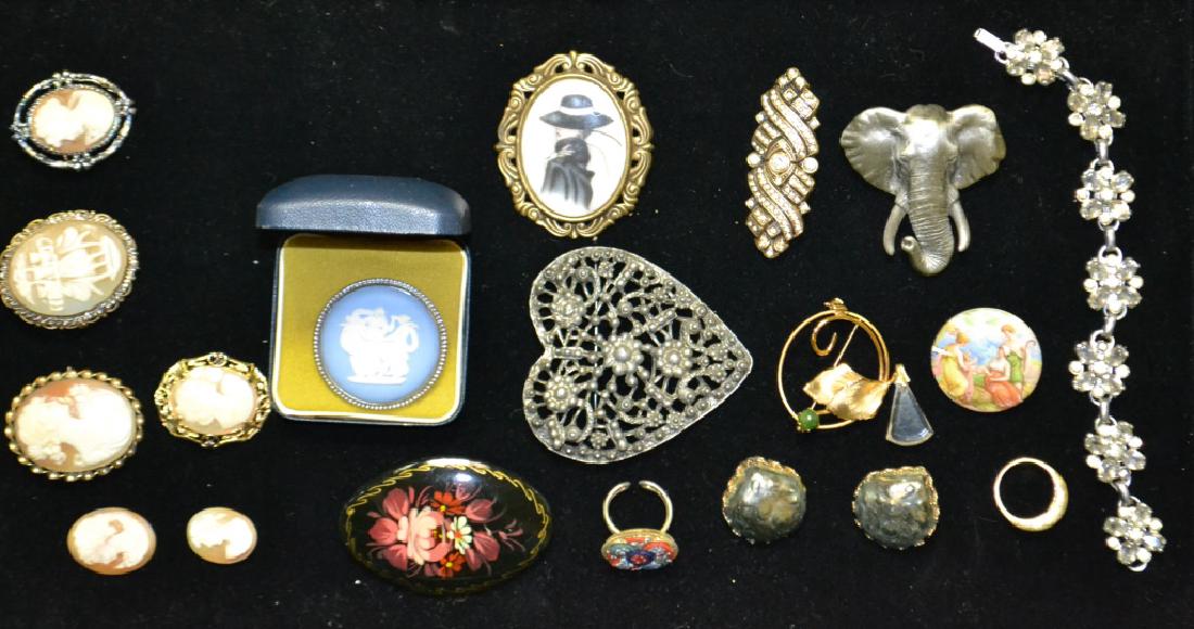 Vintage Costume Jewelry Grouping: Vintage costume jewelry including; six carved shell cameos (four mounted as pins, two loose) a Sterling Wedgewood pin in original box, two women's rings, an elephant, and others