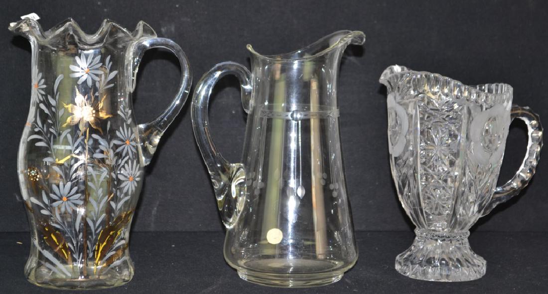 3 Piece Water Pitcher Set: 3 Piece Water Pitcher Set with hand blown and painted Victorian water pitcher with fluted top, hand blown deco pitcher with applied handle, both in good condition along with a 3rd glass pitcher (with