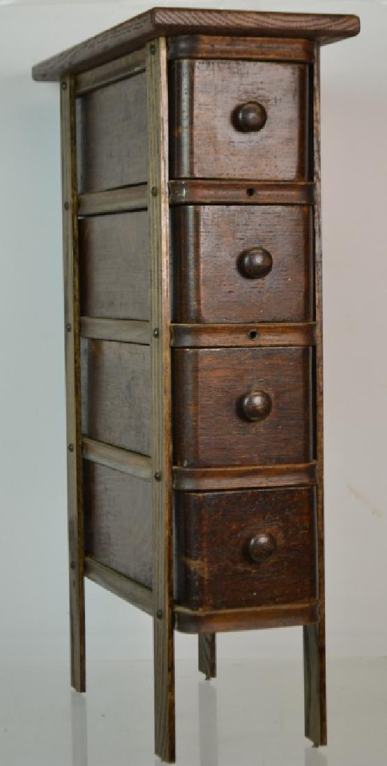 Treadle Sewing Machine Drawers In Stand: Treadle sewing machine drawers in stand 4 vertical drawers with sewing supplies original surface and oak top standing approx 25 in tall good condition
