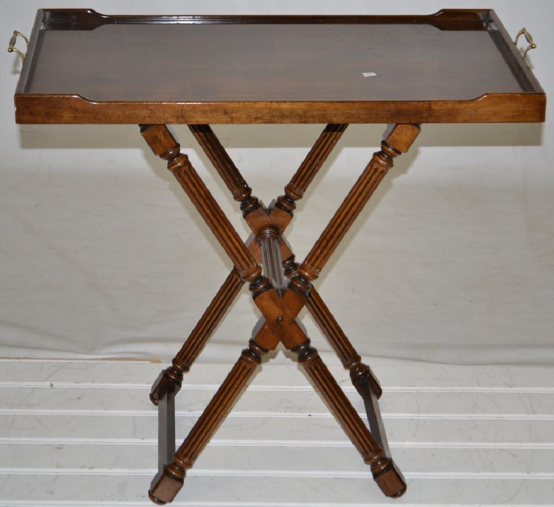 Tray Table: Table is made by Gordon's, Johnson City, Tenn. It has an ornate sawbuck base and a tray top with brass handles. It measures approx. 27 1/2"h x 30"w x 18"d.