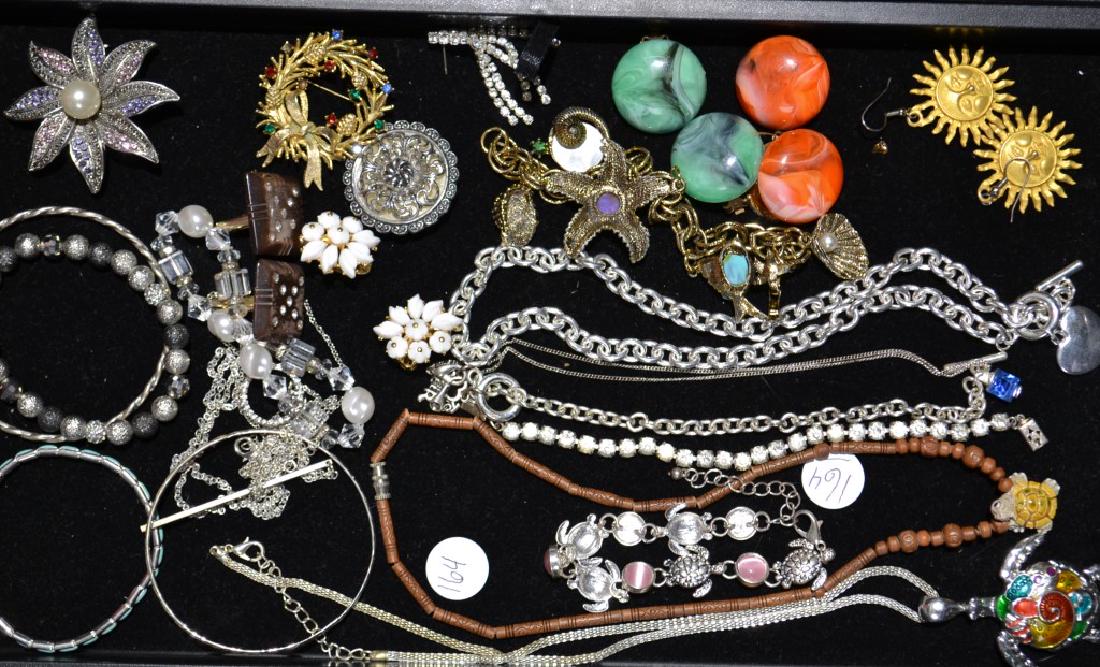 Costume Brooch and Necklace Grouping: Including turtle necklaces, beaded bracelets, signed brooches, an Oceanic charm bracelet and more.