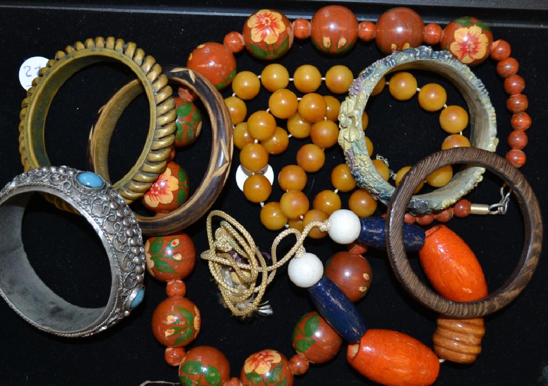 Bakelite and Other Jewelry: Including a Bakelite rope band bangle, a butterscotch Bakelite necklace and more.