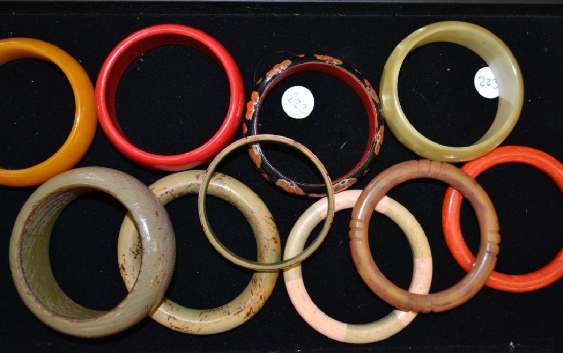 Grouping of Large Bangle Bracelets: Grouping of bangles made of Bakelite, wood and plastic. Most have good age.