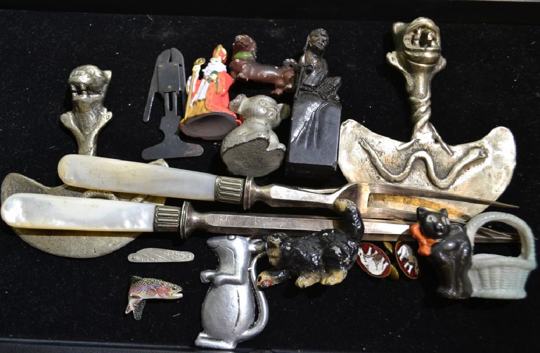 Grouping of Miniatures: Including vintage cast iron dog and cat, Bucki miniature dog paperweight, 2 figural dough cutters and more