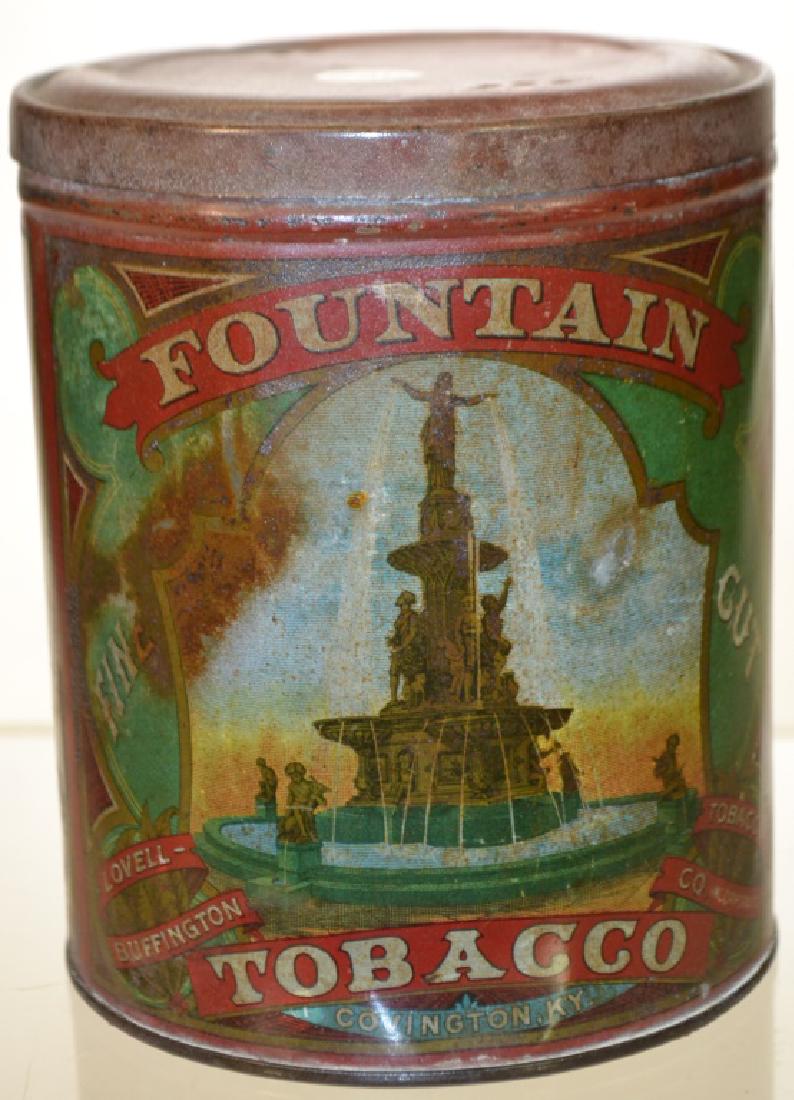 19th Century Fountain Tobacco Tin: It has full graphics on both front and back. It reads "Fist Premium Cincinnati Exposition 1872, 1873, 1874" Item has original vented lid. Graphics are crisp but shows scuffs and common wear consistent