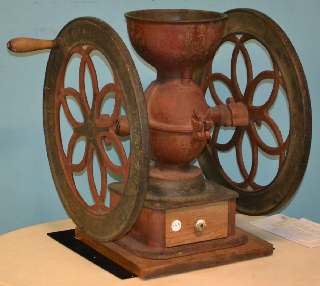 Enterprise General Store Coffee Grinder: Item measures approx. 22"h. It has original paint and stencils. It has pat date of 1873. Item is functional and the drawer has been replaced.