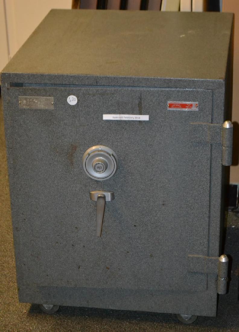 Contemporary Safe: Guardall Safe. It measures 29"h x 23"w x 25"d. It is in working condition and the auction company does have the combination.