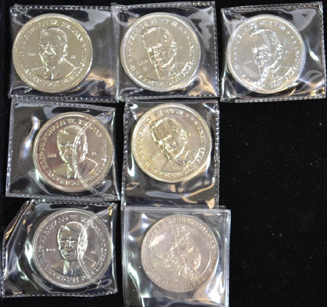 .999 Silver Presidential Coin and Others: Seven coins including three Reagan, three George H. W. Bush and an historic .999 silver Colorado mining coin (only silver coin in group)