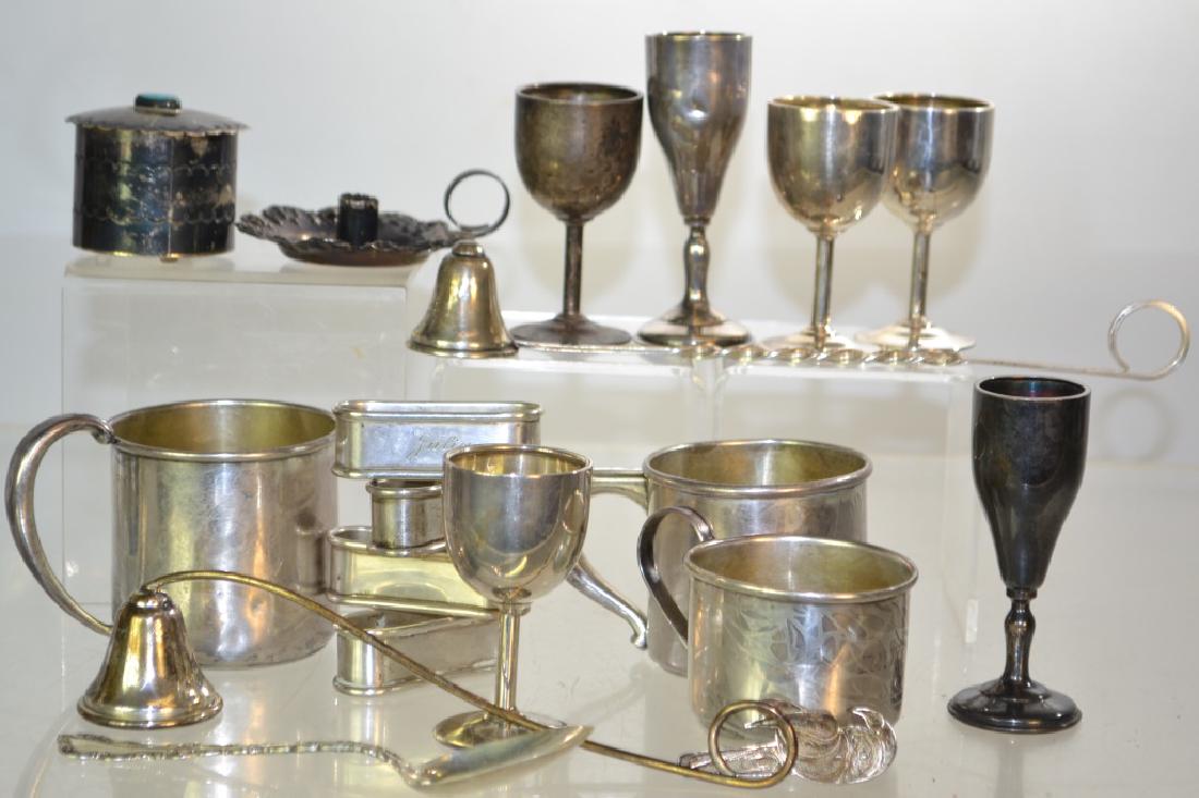 Grouping of Sterling: Weighing 20.09ozt. Lot includes baby mugs, candle snuffers, napkin rings and more.