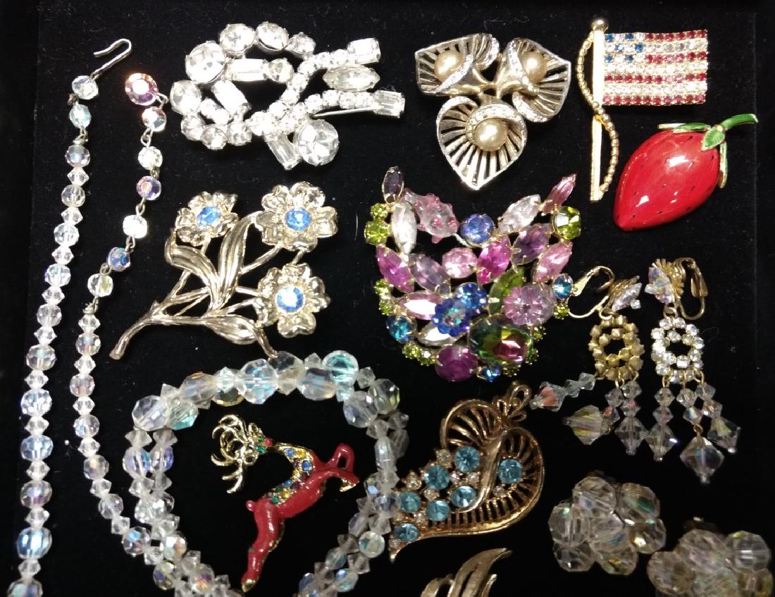 Colorful Jewelry Grouping: Including Aurora Borealis items, Hattie Carnegie pins and a Buddha pin. Other items by Lisner, Bocher and more.