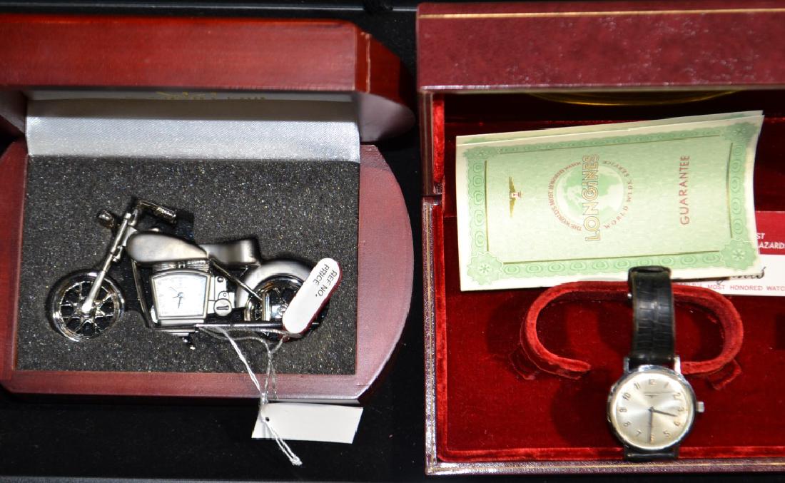 Longines Wrist Watch and More: Item has original box and paperwork. There are some scuffs on the bezel. Also a Calvin Hill pewter motorcycle with a watch in the body..