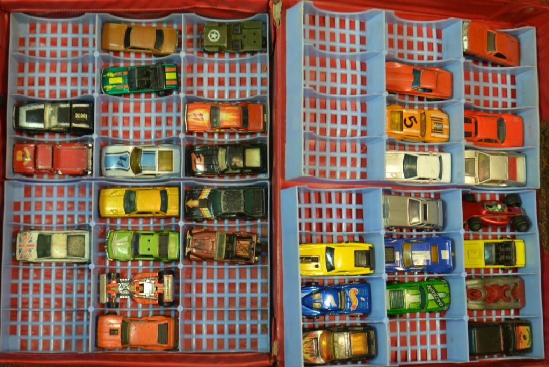 Thirty-one Hot Wheels in Case: Most are from the 1970's and some show wear consistent with age.