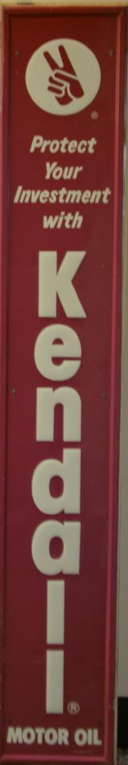 Kendall Tin Auto Shop Sign: Item measures approx. 71"h. It reads "Protect your investment with Kendall Motor Oil". It was made by Grace Comm. Inc St. Louis, Mo. Item is attached to a board for display.