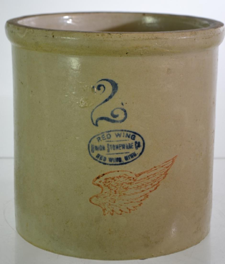 Red Wing Decorated Stoneware Crock: Item measures approx. 9 1/2"h and has a cobalt blue #2 and a Redwing stamp along with the red wing on the front.