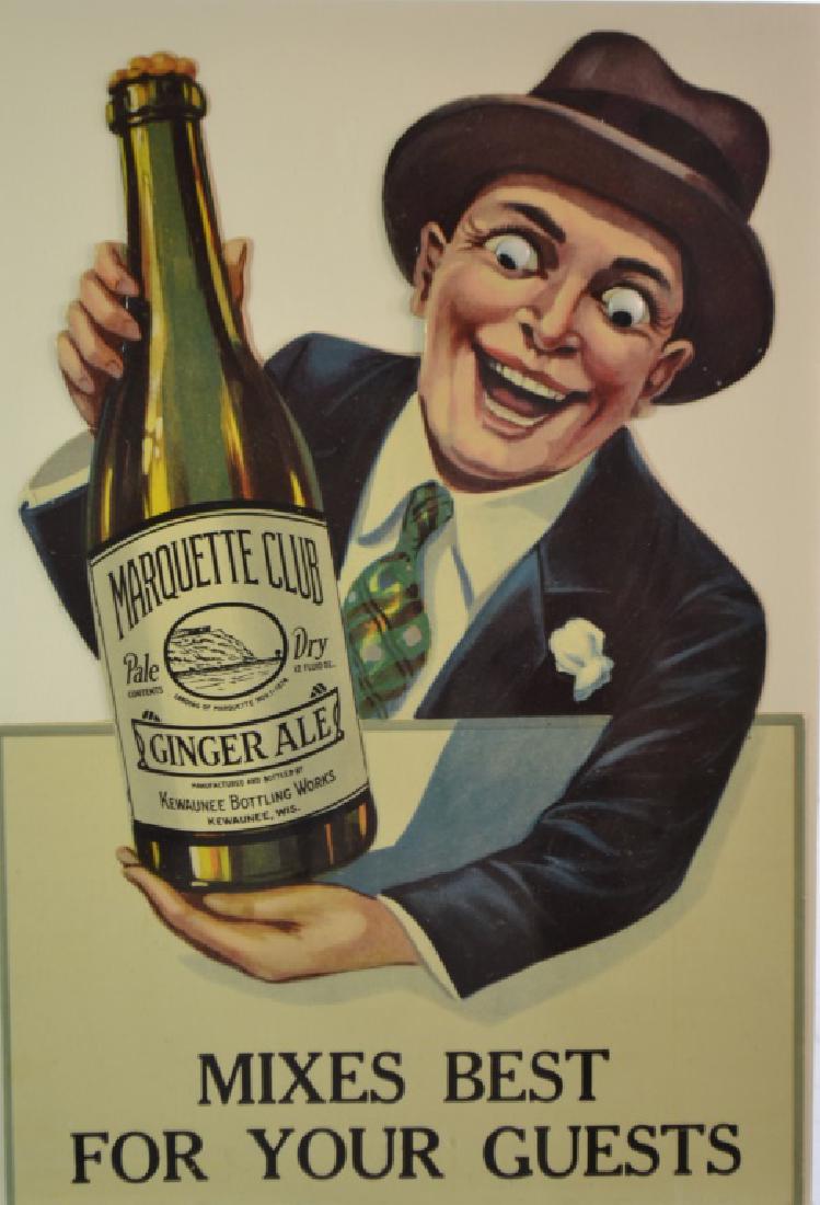 Marquette Club Ginger Ale Advertising: 1940's era advertising piece depicting a man holding the bottle with dimensional eyes. Item measures approx. 11 1/2"h.