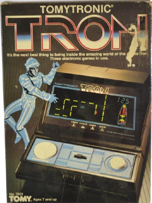 1980s Tomytronic "Tron" Electronic Game: In original box, includes 3 games in one: Life Cycle, Ring, and M.C.P game. 1981 Walt Disney Productions. Batteries not included. Note: Electronics have not been tested.