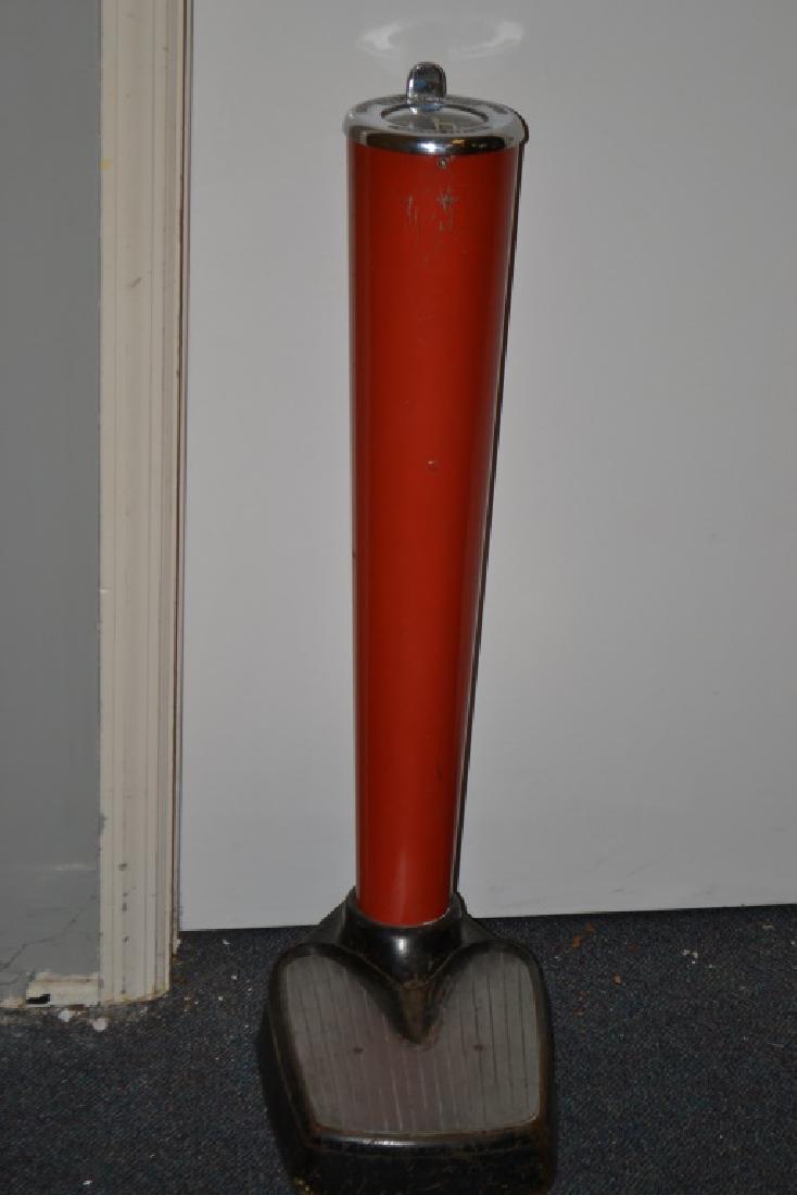 "Menkhaus" Drop Coin Scale: Item measures approx. 35"h. It has a red body with a chrome top and has a 300 lb capacity.