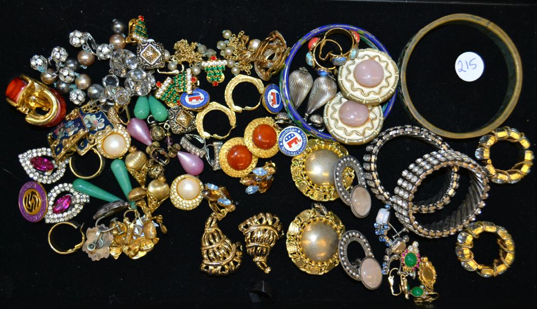 Bracelets and Earrings: Including an inlaid brass bracelet, two rhinestone bracelets, various clip earrings - some by Kramer, Trifari, Monet, and more.