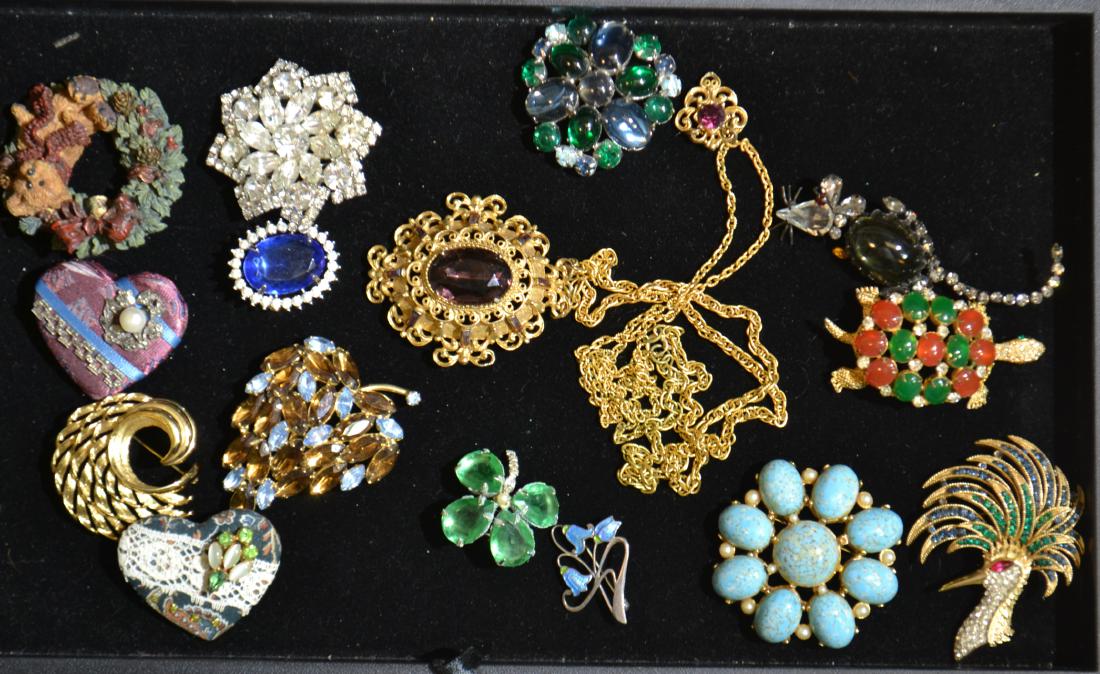 "Brania Mimi Di N " Pin and More: Includes a large gold tone Monet tropical bird head pin, a turtle head signed " Brania Mimi Di N" and more.