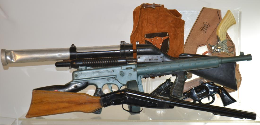 Toy Guns: Includes a "Pony Boy" cap pistol and holster set, a Tommy gun and more.
