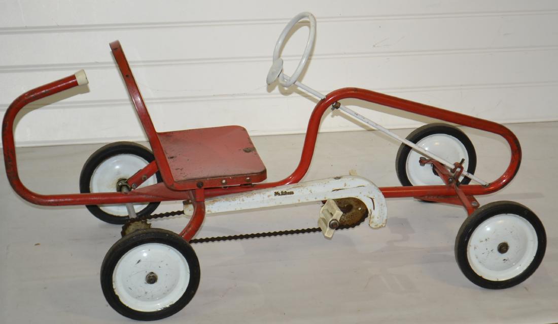 Halstrom Vintage Pedal Car: Item measures approx. 47" in length. It has the original wheels, original paint and the original race flag decal. Surface shows common wear consistent with age and usage.
