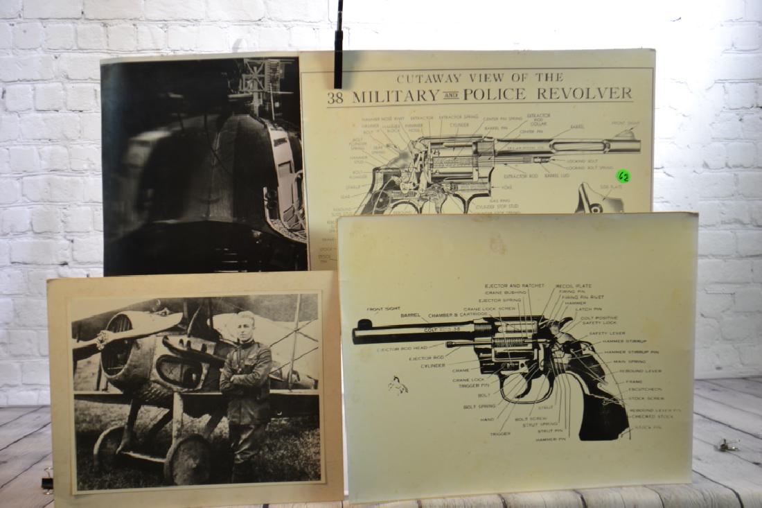 Smith & Wesson Educational Charts: Two 38 mm revolver charts diagramming the interior of a gun, a photograph of Lindbergh and a plane and a photograph of a satellite.