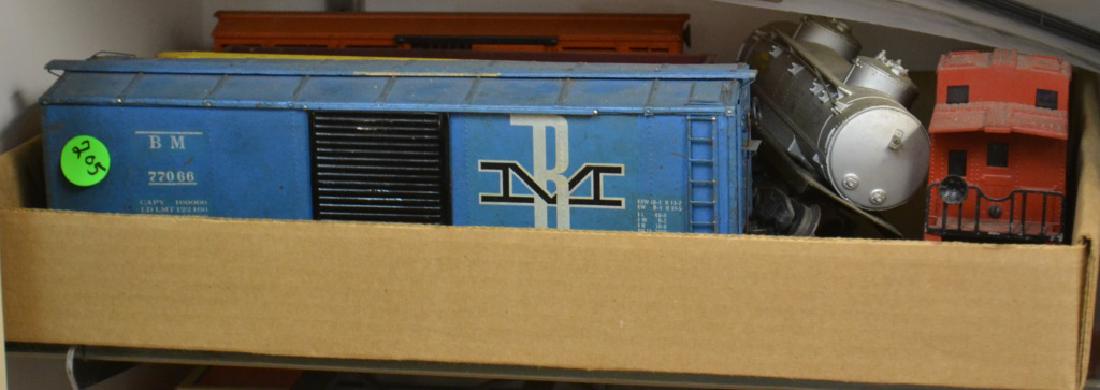 Lionel O Gauge Train Cars: Including a caboose #6357, a mechanical stock car, a Sunoco oil tanker and more. Note: the yellow car shows heavy oxidation on one set of wheels.