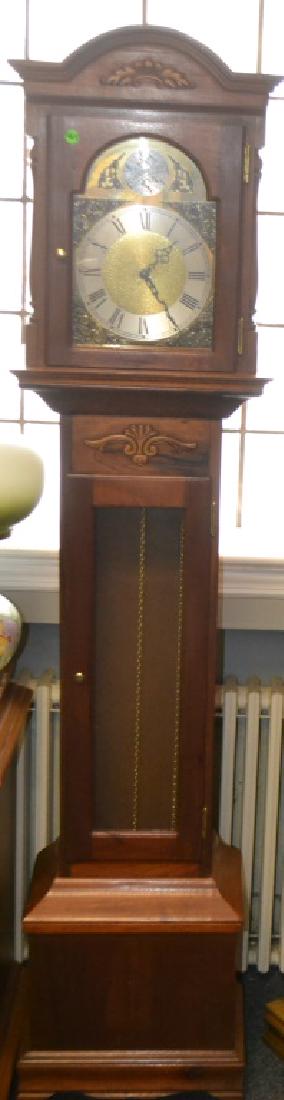 Western German Grandmother Clock: Item measures approx. 70"h. It is marked "Tempus Fugit:, has a mahagony case and appears to be complete.