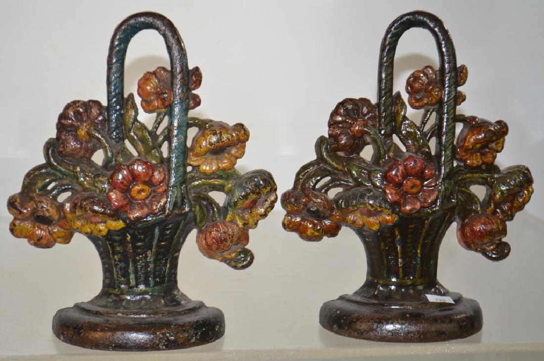 Pair of Hubley Cast Iron/Door Stops: Items measure approx. 8 1/2"h each and have the original paint. They can be used as bookends or door stops and are unmarked but attributed to Hubley.