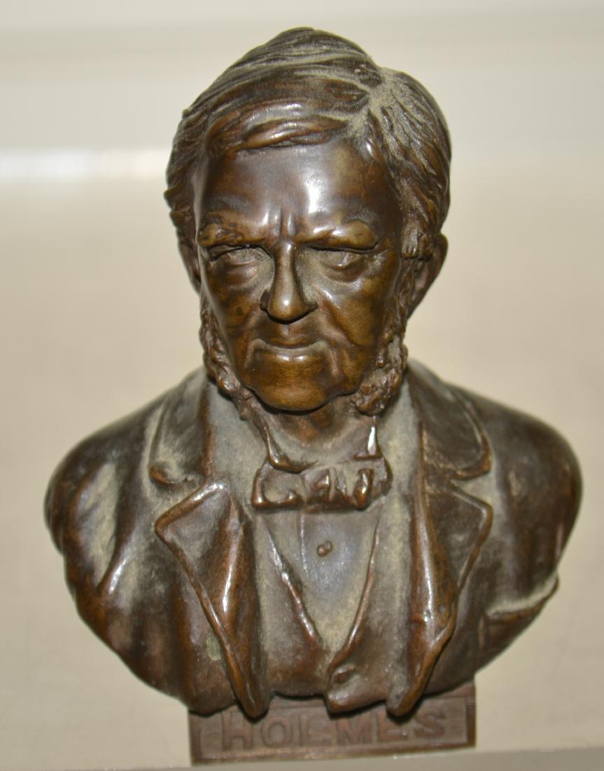 Miniature Bronze Bust of Holmes: Item measures approx. 4"h. It is a well executed bronze with a stamp on the back reading "copyright 1897 ACM CLURG & Co".