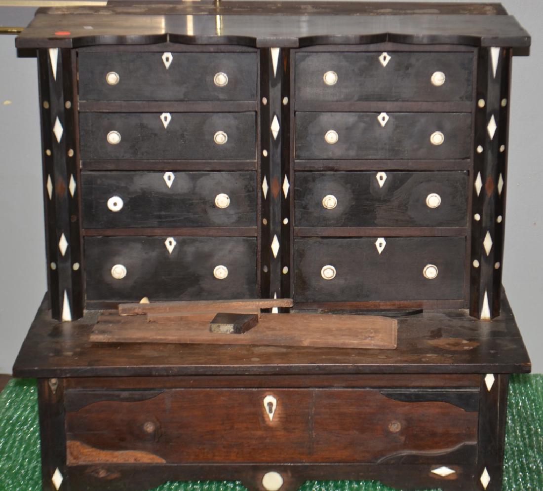 19th C Apothecary w/ Bone Inlay, Blair Estate: Item measures approx. 22"h x 24 1/2"w x 17"d. It is constructed from exotic woods. The top section has eight hand dove tailed drawers with bone escutcheons and knobs. The base has one large drawer and