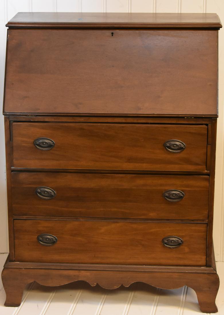 20th Century Drop Front Desk: Item measures approx. 41"h x 30"w x 16"d. It has a cubby interior above three drawers and has the original hardware.