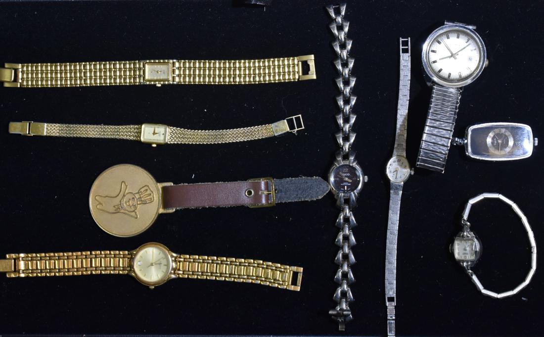 Grouping of Wrist Watches: Including a lady's Gucci wjth Japan movement, lady's gold tone Citizen watches, a lady's Caravelle Swiss and a Sheffield Swiss pendant watch.