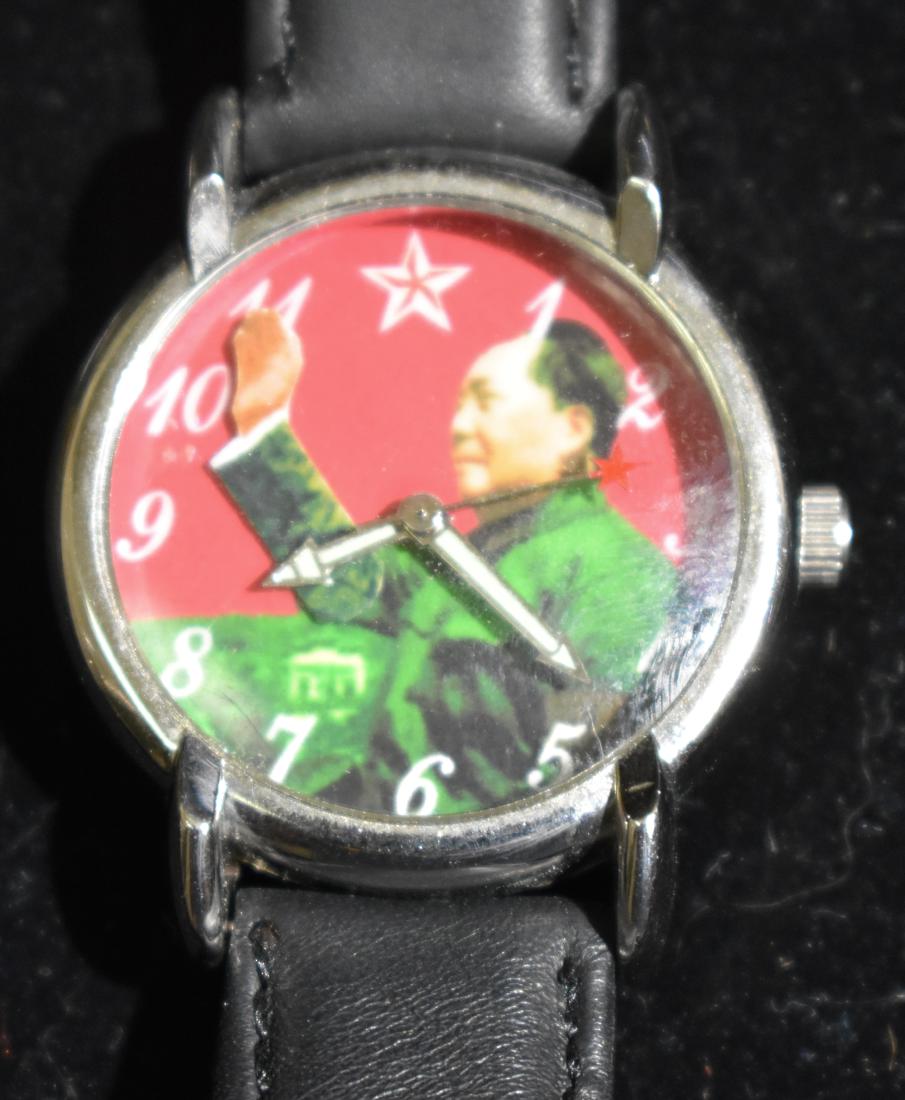 Chairman Mao Wristwatch: Face depicts a likeness of Chairman Mao, the arm moves as a second hand, the sweep second hand has the Chinese star at head and all information on back is in Chinese. It is a wind up watch.