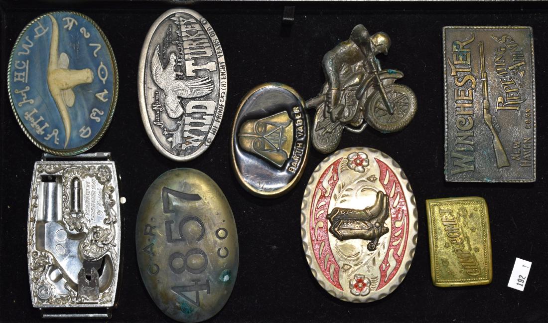 Grouping of Belt Buckles: Nine belt buckles including "Winchester", "Camp Comet", "Darth Vader", "Wild Turkey" and others.