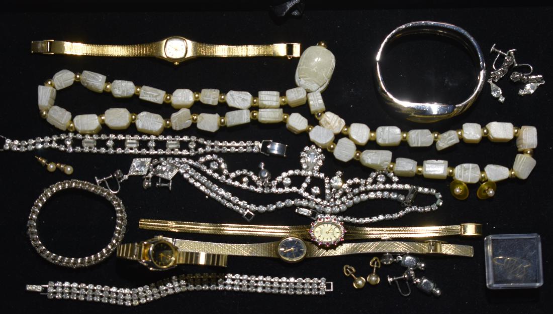 Lady's Watches and Rhinestone Jewelry: Including a lady's "Armitron" wrist watch with "Deauville" diamonds, a "Mayfair" lady's watch with a cuff band, a good selection of rhinestone necklaces and a white stone necklace.