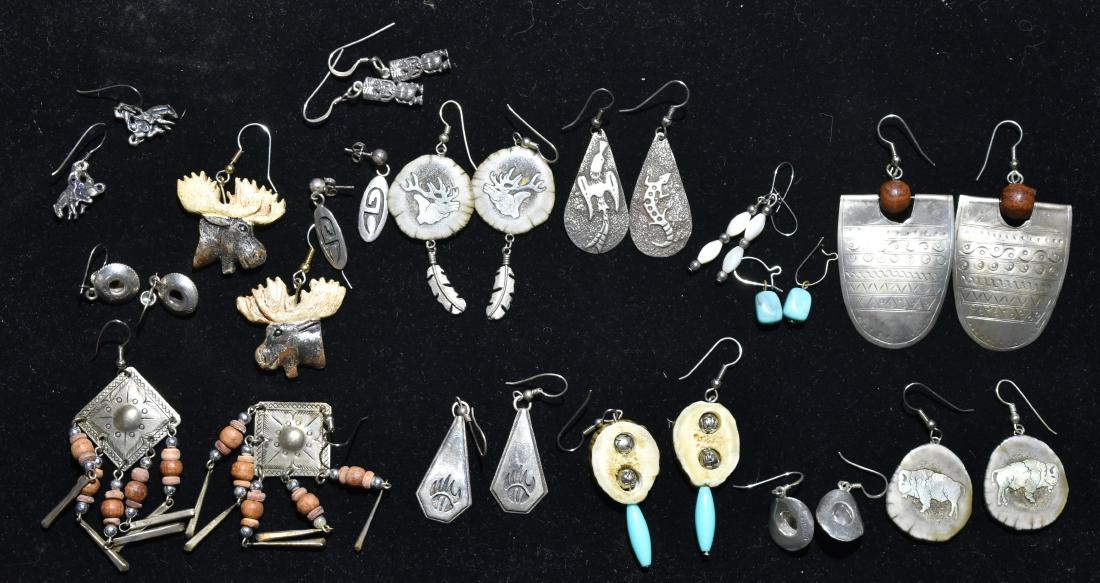 Native Sterling and Other Earrings: Including sterling and turquoise earrings, sterling lizard earrings, sterling totem earrings, earrings with inlaid sterling buffalo and caribou and various other sterling earrings.