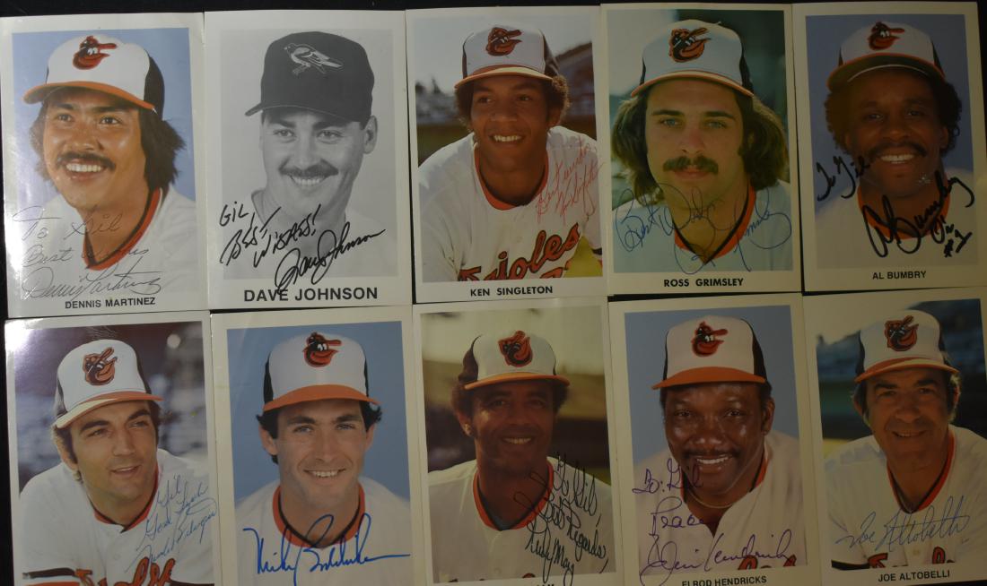 Autographed Baltimore Oriole Photos: Ten photos including Rudy May, Elrod Hendricks, Ken Singleton, Mike Boddicker and others. Note: Auction house does not have certificates of authenticity on these items.