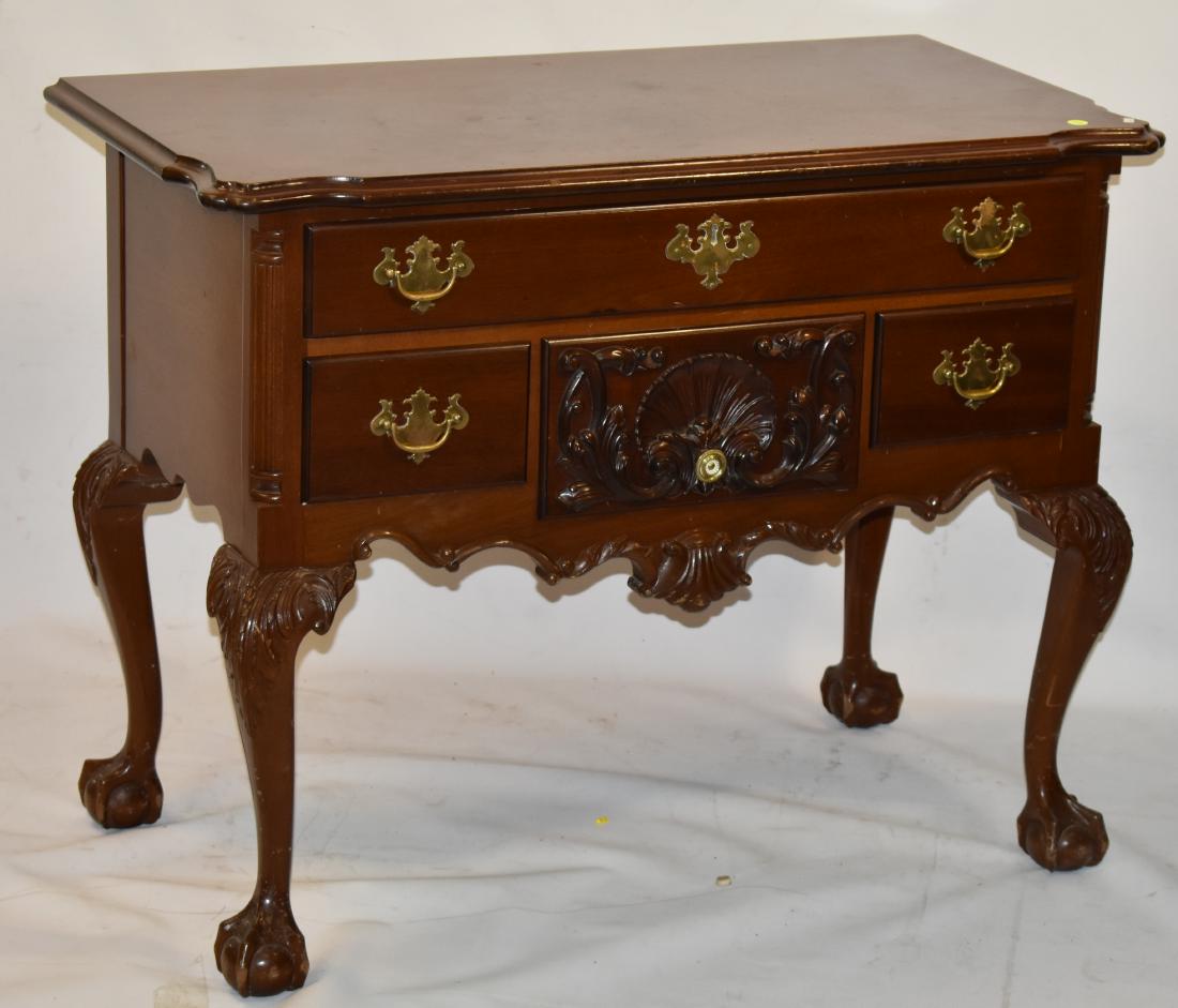 "Feldenkreis" Philadelphia Style Lowboy: Item measures approx. 30"h x 38"w x 20"d. It is mahagony construction with machine dove tailed drawers, has a nicely carved shell skirt with a high knee and stands on large ball and claw feet.
