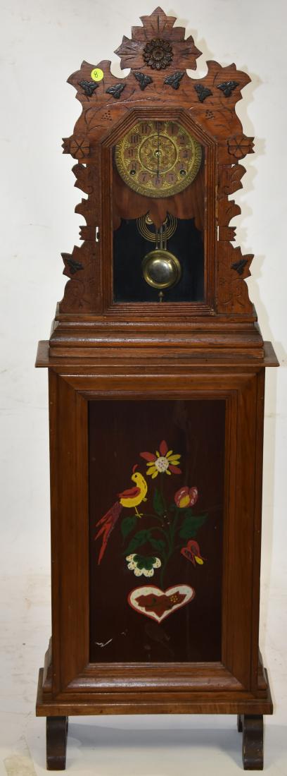 19th Century Mantle Clock on Stand: Item measures approx. 50"h. The clock has a brass face with pendulum and key and stands on a base that was once an ogee clock.