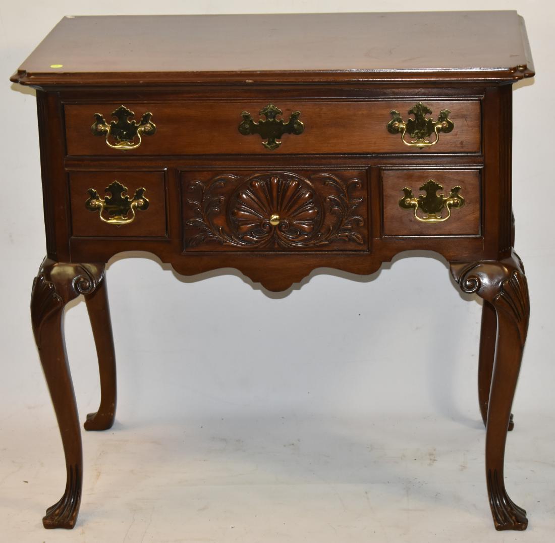 Contemporary Mahagony Low Boy: Item measures approx. 31"h x 32"w x 19"d. Item has four drawers, a scrolled skirt, a high knee and stands on a duck foot.