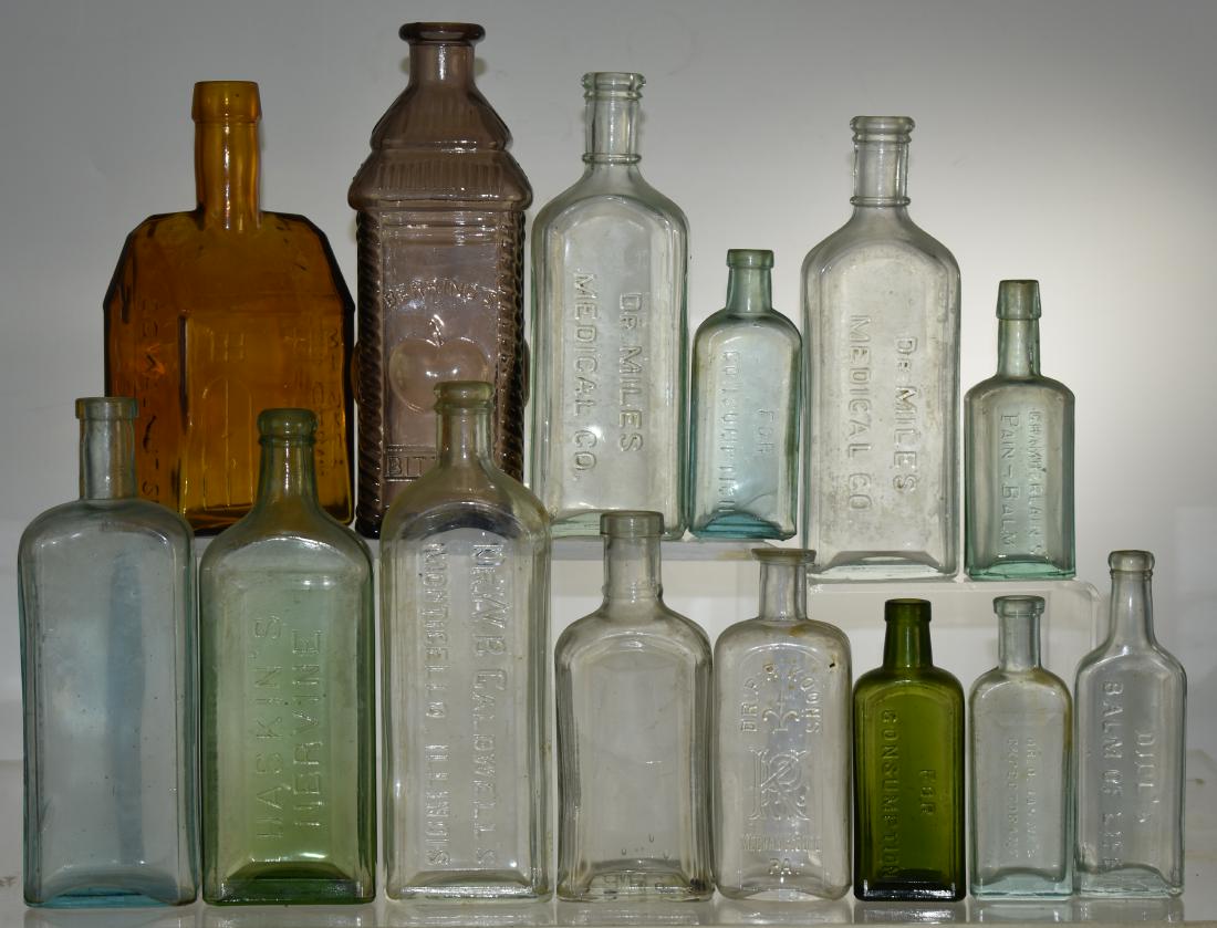 Early Advertising Bottles: Twelve advertising bottles including "E.C. Booz's Old Cabin Whiskey", "Berring's Apple Bitters ", "Dr. Klein's Great Nerve Restorer" and others.