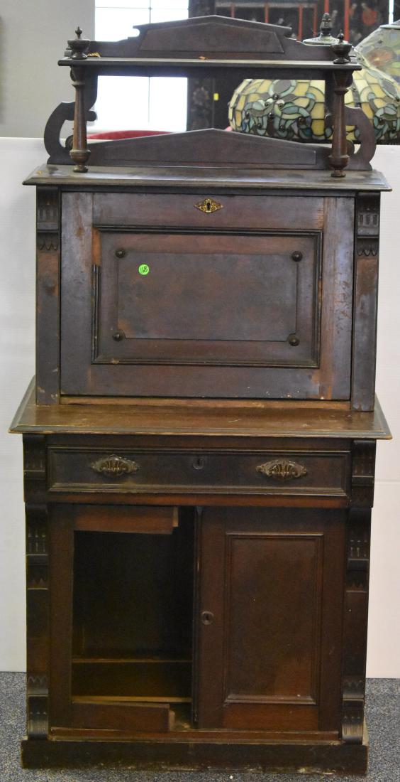 Victorian Lady's Parlor Desk: Item measures approx. 54"h x 28"w x 19"d. It has damage at one hinge, some loss to trim and one door has come unglued but the parts are present. Sold in "as found condition".