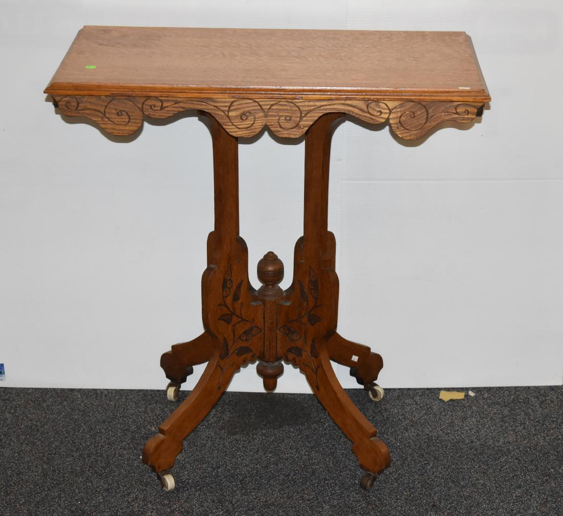 Victorian Oak Side Table: Item measures approx. 30"h x 30"w x18"d. It is a soldi oak table with deoratvie cut outs and the original surface.