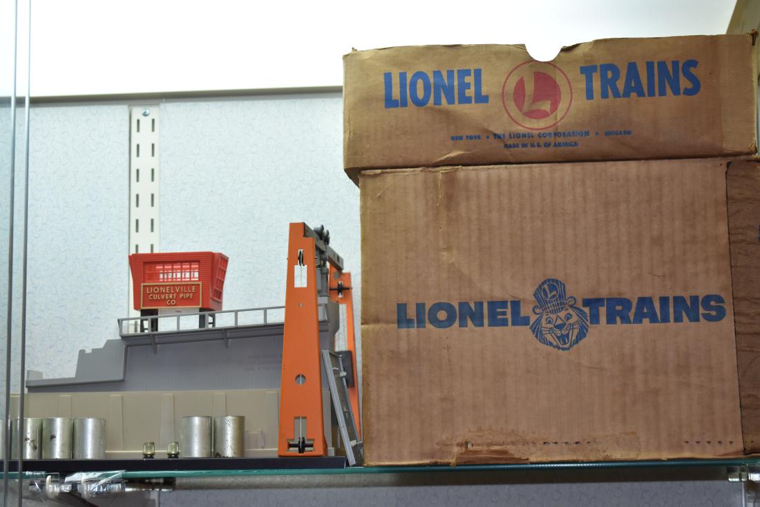 Lionel Train Accessories with Boxes: Items include No. 345 operating culvert unloader with pipes and Lionel 022 remote control gauge switch.