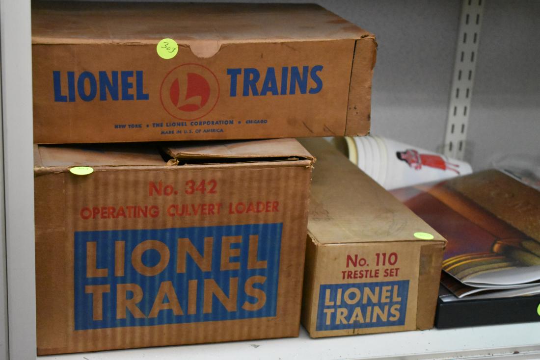 Lionel Train Accessories in Original Boxes: No. 342 operating culvert loader, No. 110 trestle set, and No. 022 remote control switch. All items have original boxes.